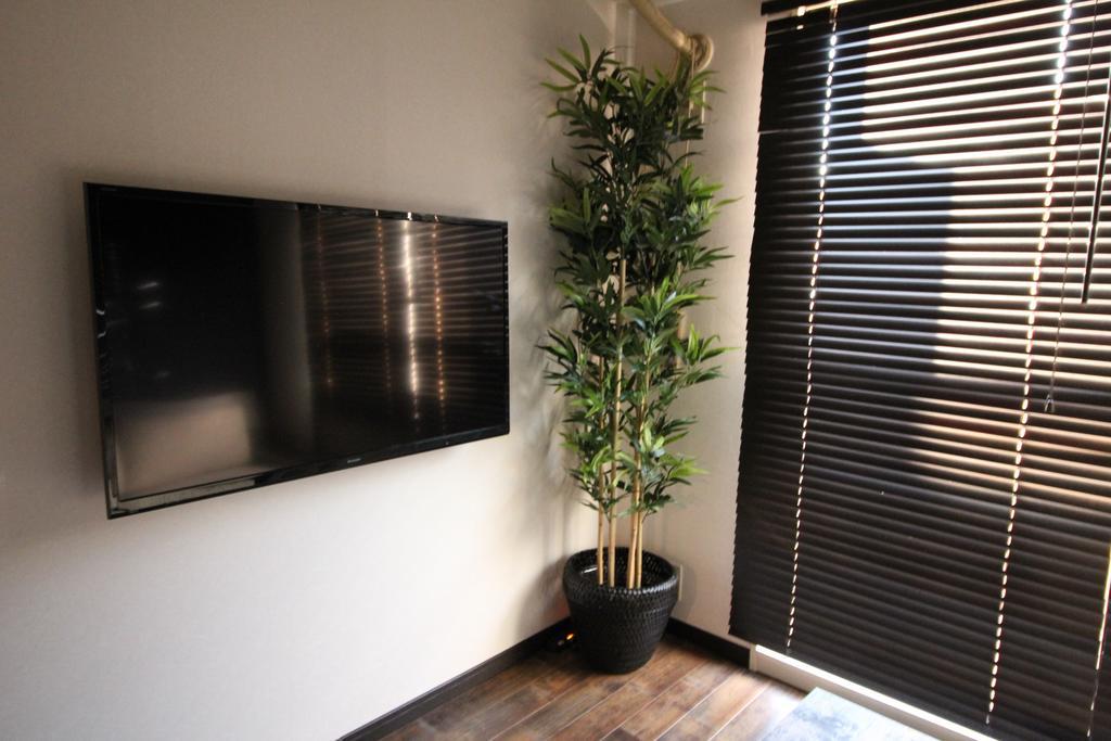 Ookini Hotels Karasuma Gojo Apartment Киото Номер фото