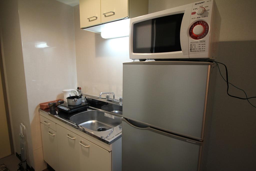 Ookini Hotels Karasuma Gojo Apartment Киото Номер фото